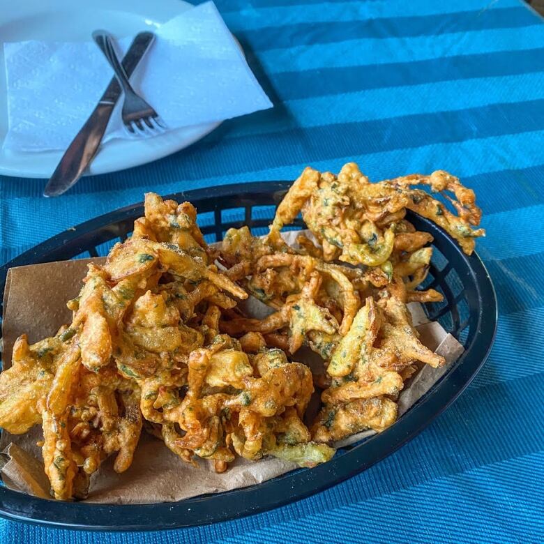 Vegetable dish served in a basket at a restaurant. 