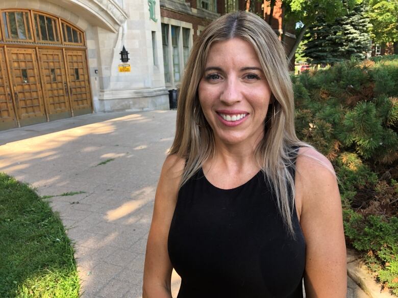 Danielle Findlay poses in front of the former W. D. Lowe High School.