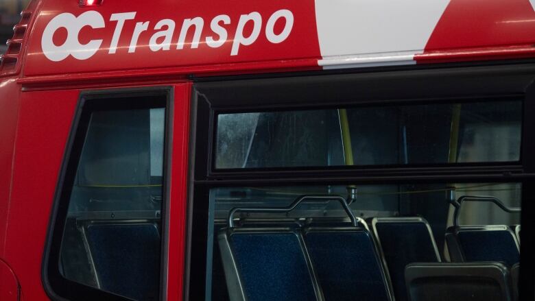 Empty blue seats on a red bus