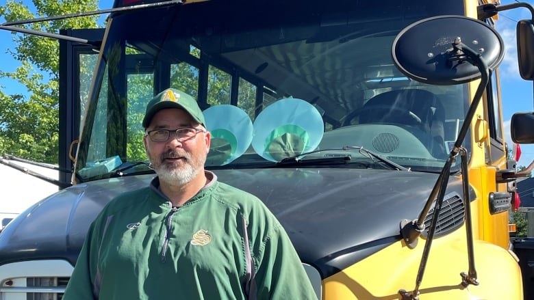 Rob Harding in front of his school bus.