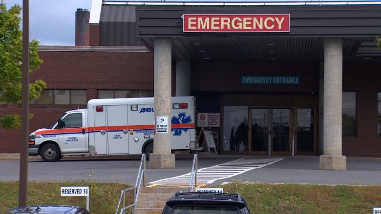 An ambulance parked outside an emergency room. 