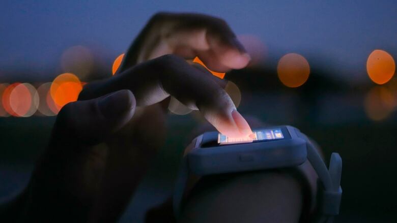 Finger taps on a smartwatch screen