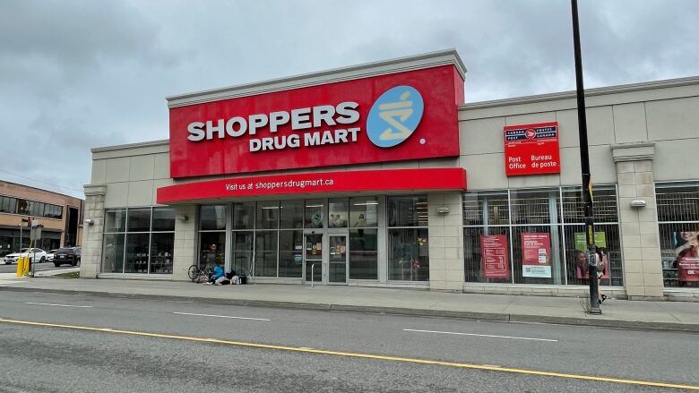 A pharmacy on a downtown street.