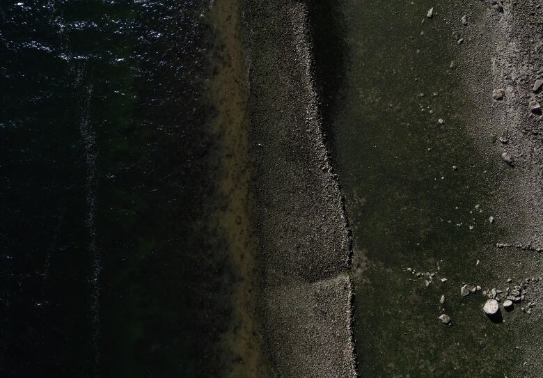 An aerial shot of a beach with visible ridges on it.