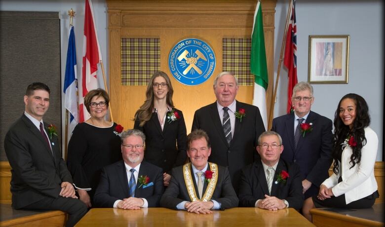 The mayor and city councillors pose for a group picture in the Timmins council chambers