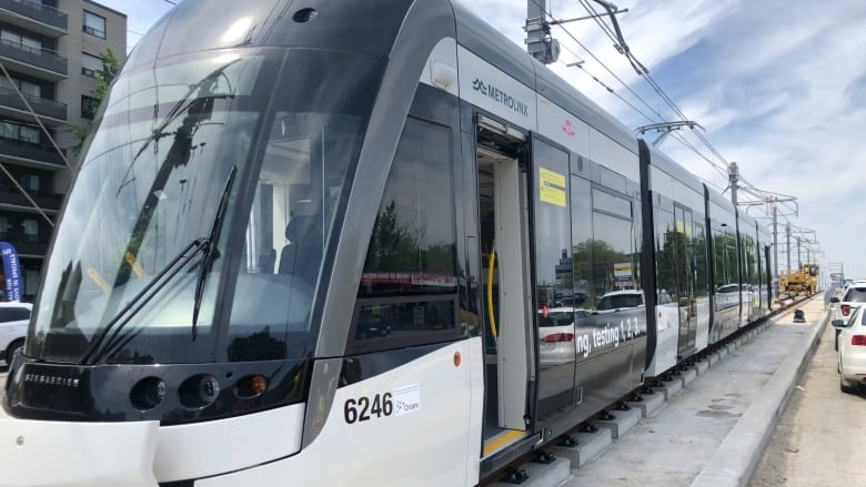 An Eglinton Crosstown test vehicle is loaded onto the tracks on Eglinton Avenue. 