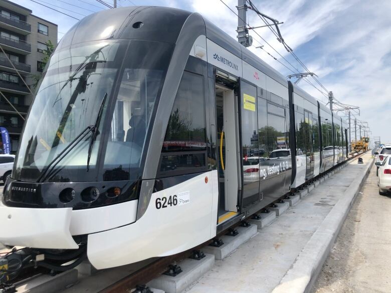 An Eglinton Crosstown test vehicle is loaded onto the tracks on Eglinton Avenue. 