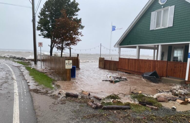 A house is surrounded by water. 