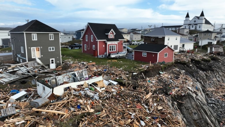 Extensive damage to homes after a storm.