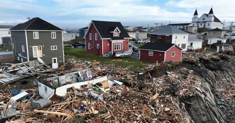 Extensive damage to homes after a storm.