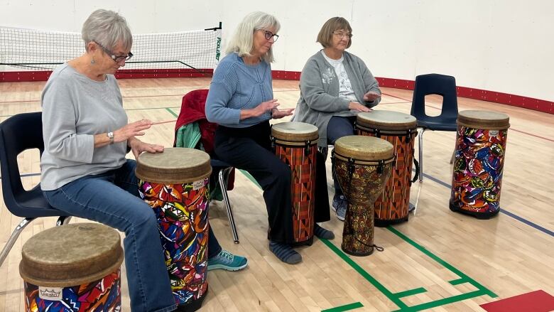 Three ladies drumming 