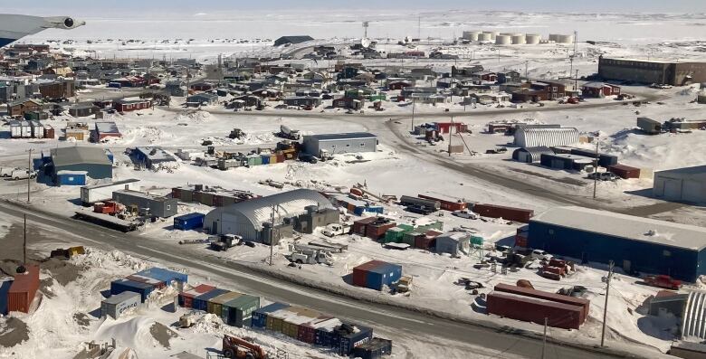 An aerial shot of an Arctic community in winter.