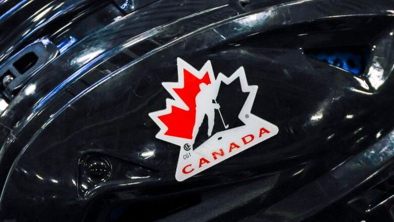 A hockey helmet with Canadian logo.