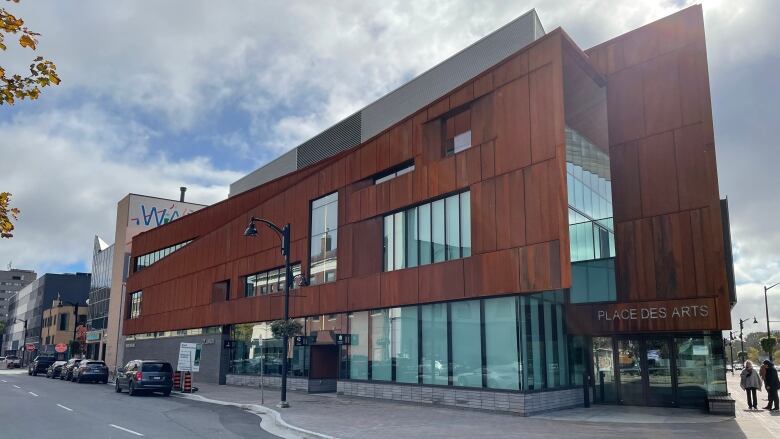 A large rust-coloured building.