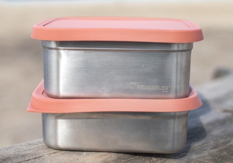 A pair of steel lunchboxes.