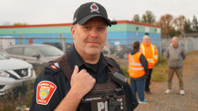 A police officer stands for a portrait. 