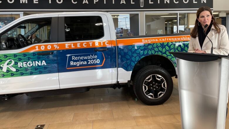 Mayor Sandra Masters talks to media as she unveils the first electric vehicle in the City of Regina's fleet