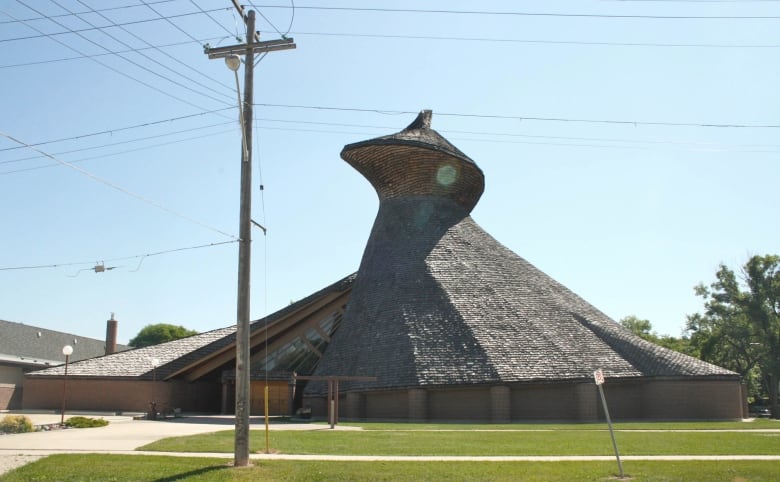 A building with a twisting, corkscrew-style roof is shown.