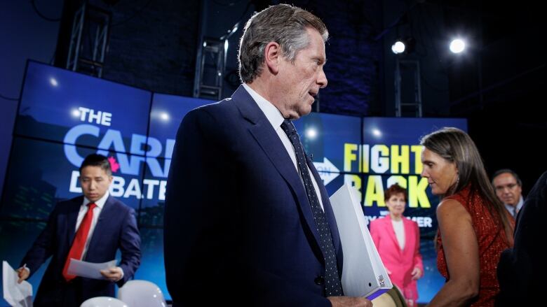 Toronto mayor John Tory walks away from the first major debate of the campaign on October 13.