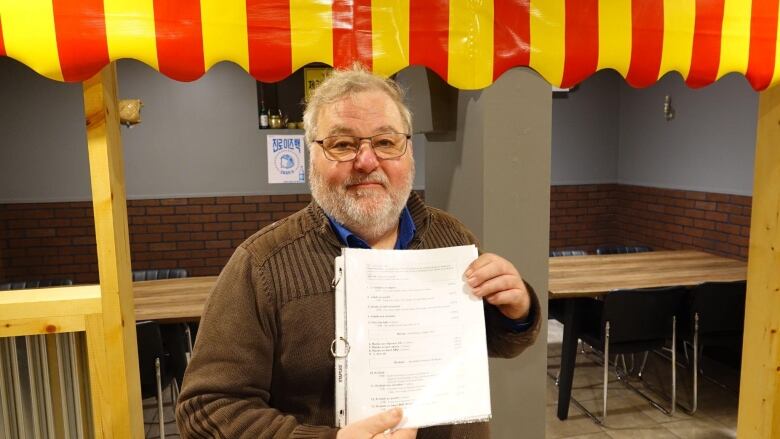 Man holding a menu 