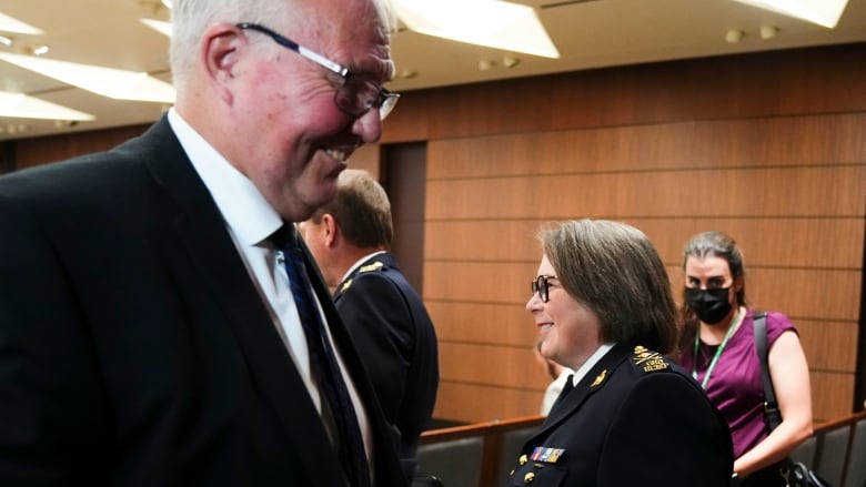 Minister Emergency Preparedness Bill Blair smiles as he passes RCMP Commissioner Brenda Lucki. Both are witnesses at the Standing Committee on Public Safety and National Security on Parliament Hill in Ottawa on Monday, July 25, 2022. The committee is looking into allegations of political interference in the 2020 Nova Scotia Mass Murder Investigation.