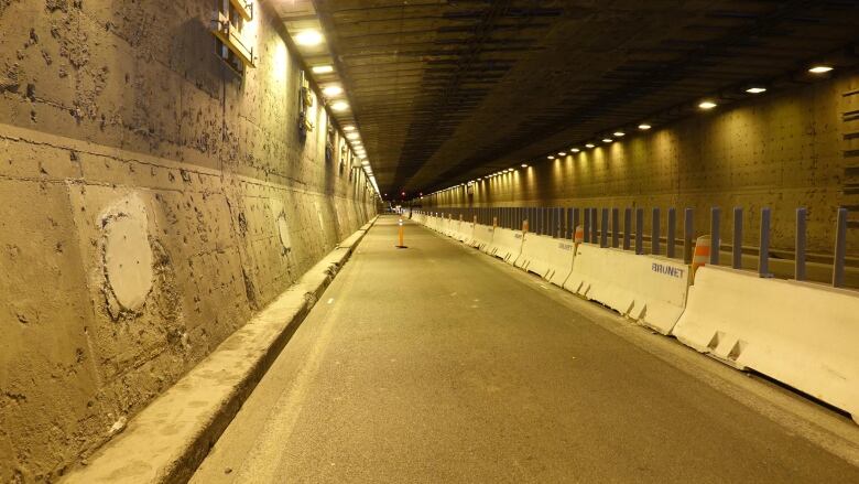 Lanes inside of a tunnel. 