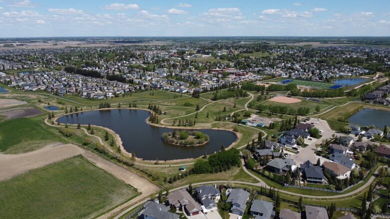 A drone view taken in May shows neighbourhoods, lakes and recreational paths in a suburban neighbourhood.