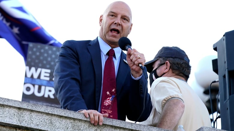 Pennsylvania state Sen. Doug Mastriano speaks to supporters outside the Pennsylvania State Capitol, in Harrisburg, Pa.