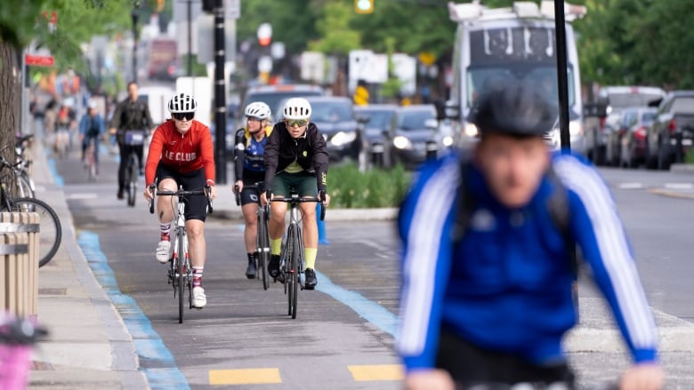 People are riding bikes. 