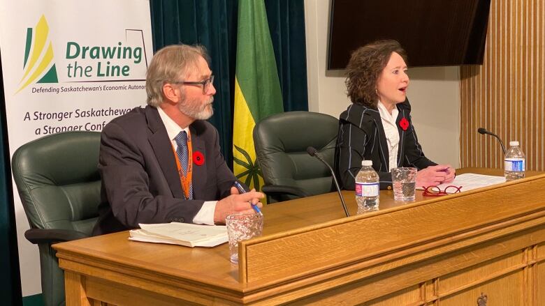 The director of the province's Constitutional Law Branch, Mitch McAdam (left), and Saskatchewan Justice Minister Bronwyn Eyre (right) take questions regarding the Saskatchewan First Act and its related amendments aimed to outline provincial jurisdiction over natural resources.