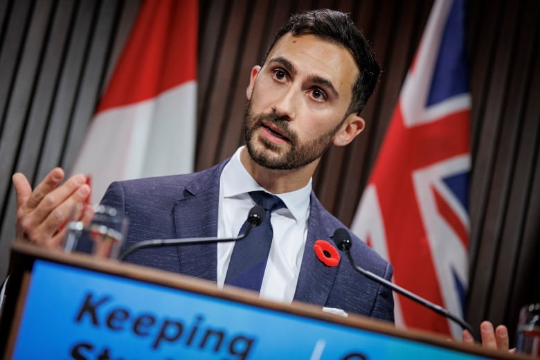 Education Minister Stephen Lecce speaks with members of the Queens Park press gallery on Oct. 31, 2022, after tabling legislation meant to halt a strike by CUPE-represented education workers.