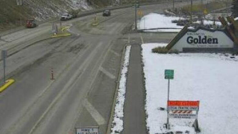 A webcam view of a snowy road, with a 'Welcome to Golden' sign to the right of the image.