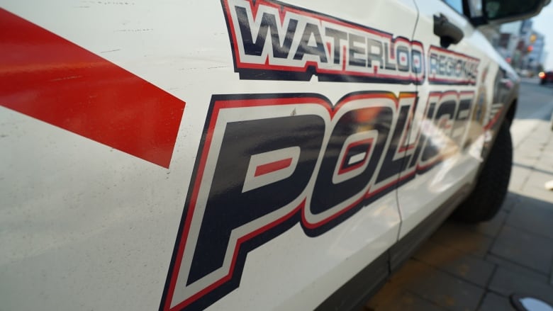 A close up of the side of a police cruiser that reads: Waterloo Regional Police.