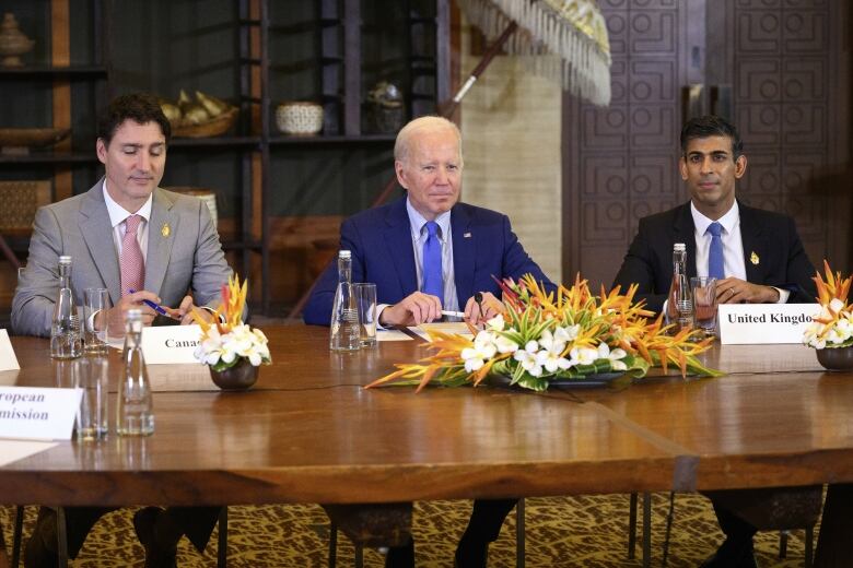 U.S. President Joe Biden, Canadian Prime Minister Justin Trudeau and British Prime Minister Rishi Sunak attend an emergency meeting of leaders at the G20 summit on Wednesday.