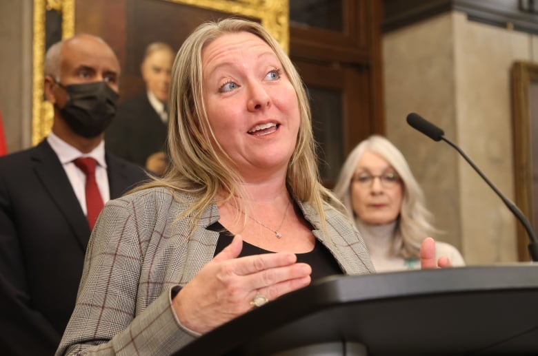 A politician speaks at a lectern.