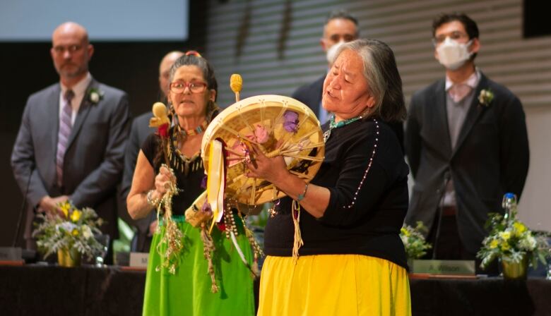 Two women drumming