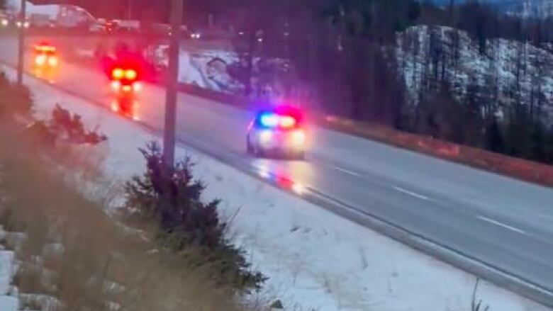 A still taken from video shot during a closure of the Coquihalla Highway on Nov. 23, 2022, shows a line of emergency vehicles rushing to deal with an undisclosed incident.