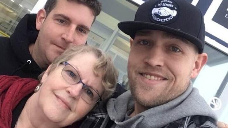 Mary MacDonald, seen here with her youngest son Luke Landry (wearing the hat) and her middle son Julian says Luke may have had his troubles, but was also a beloved son, brother, father and friend. 