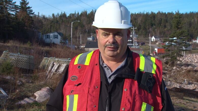 Osborne Burke is GM of Victoria Co-operative Fisheries Ltd. in Neils Harbour. He stands outside the fish plant that was damaged during hurricane Fiona.