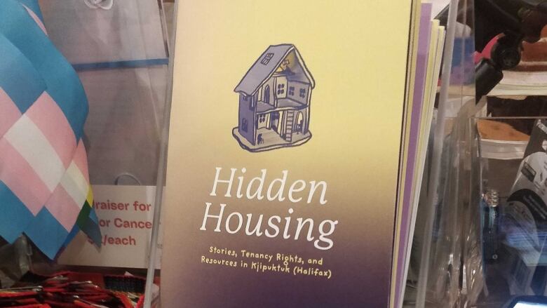 Copies of the first Hidden Housing Stories zine on display.