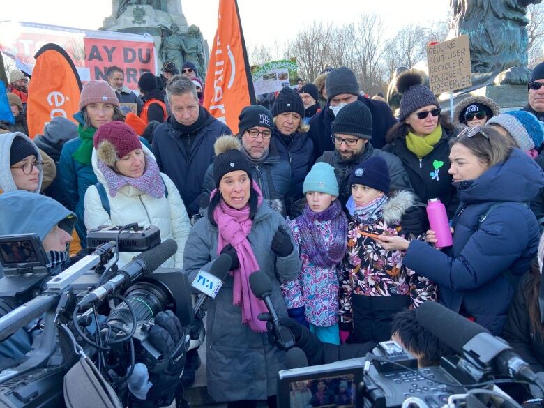 Valerie Plante answers journalists' questions at the protest.