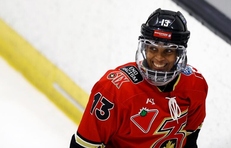 Mikyla Grant-Mentis of the PHF's Toronto Six smiles through the cage of her helmet after scoring a goal.