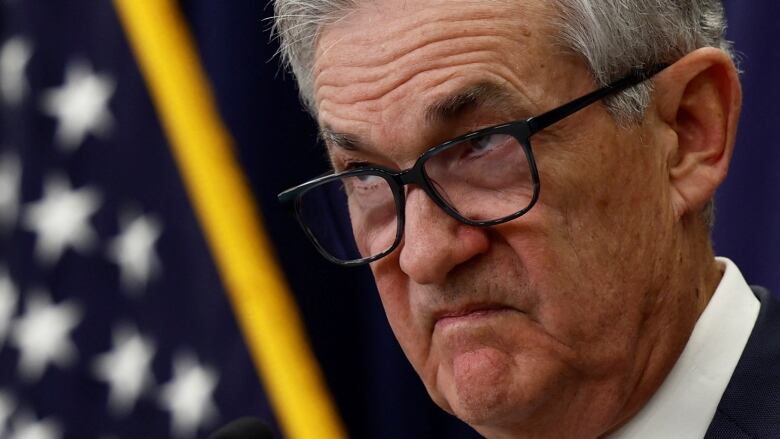 Federal Reserve Board Chairman Jerome Powell looks on during a news conference following the announcement that the Federal Reserve raised interest rates by half a percentage point.