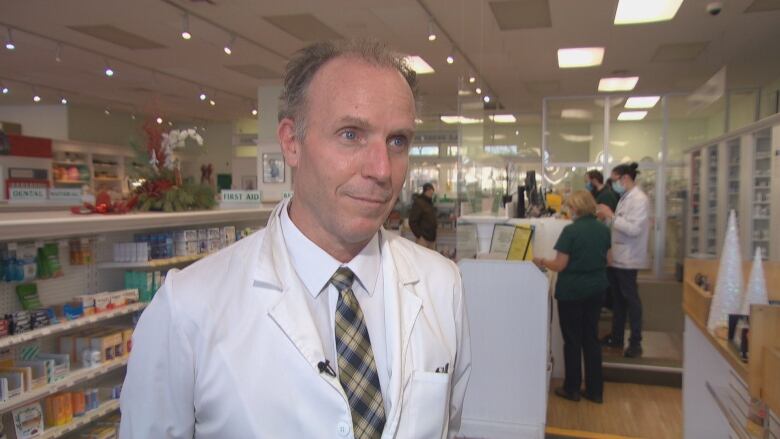 Pharmacist Scott Watson stands in his Ottawa pharmacy. 