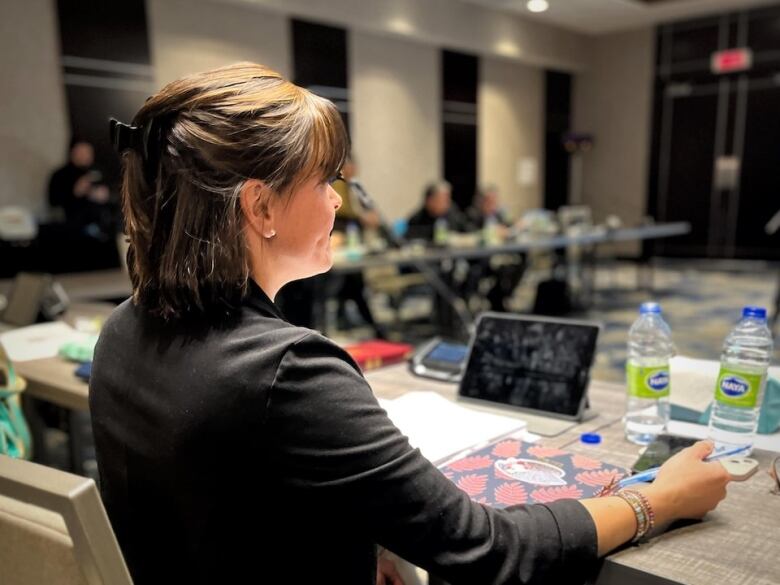 Woman at board meeting