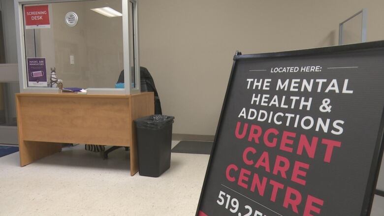 A waiting room with a sign that reads 