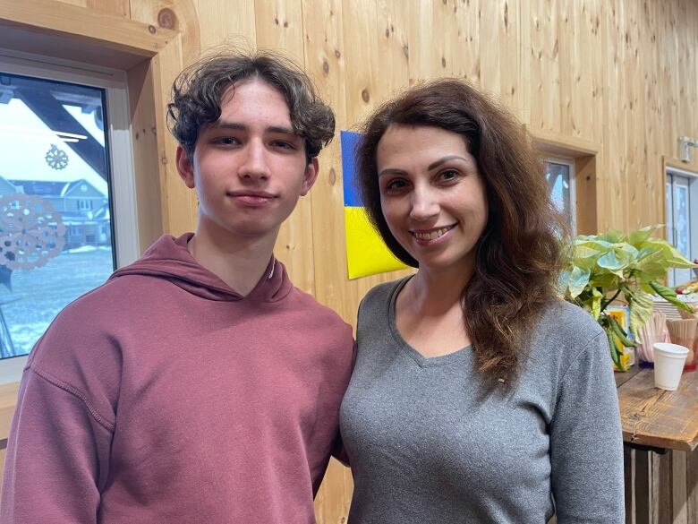 16-year-old Tuimur Fenko stands with his mum Hanna. The family arrived in Canada in late November, just in time to celebrate St. Nicholas Day in safety. 