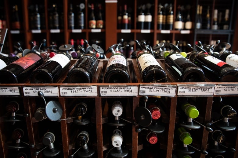 A row of red wine bottles are seen on display inside a store in Vancouver.