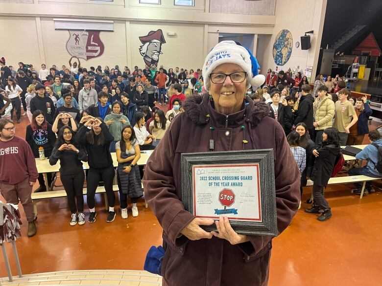 Mary Morrison, 82-year-old crossing guard, at Colonel Grey High School to accept the PEI Home and School Federation award for Crossing Guard of the year.