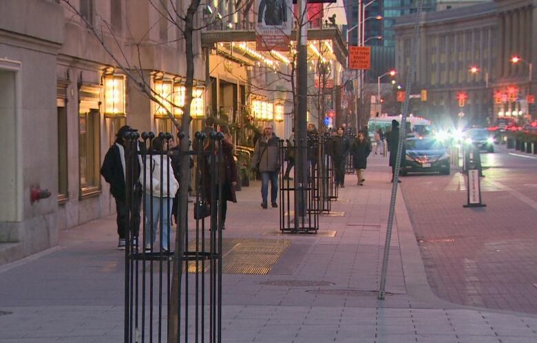 People walk in downtown Toronto.